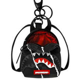 center rip revealing gray check backpack keychain 