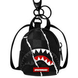 center rip revealing gray check backpack keychain 